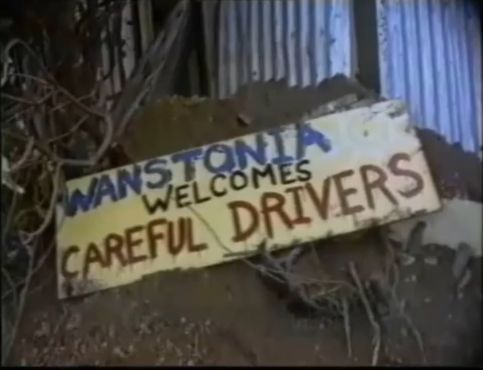 A sign reading "Wanstonia Welcomes Careful Drivers"