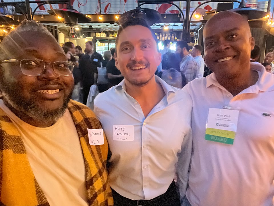 Three men, including the author, posing for a photo.