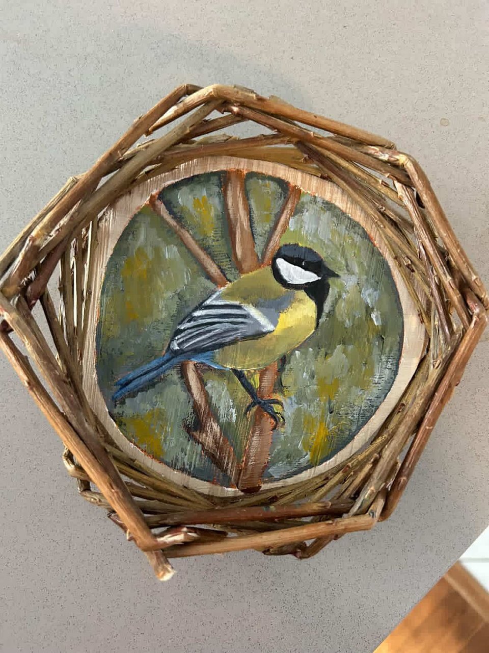 Basket with a painting of a chickadee
