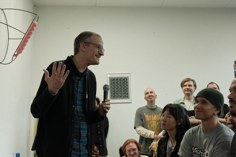 Jeremy Couillard, game designer and painter, speaks to an audience