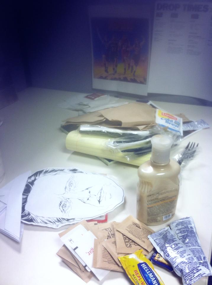 my newsroom desk covered with stuff from when a friend left the job