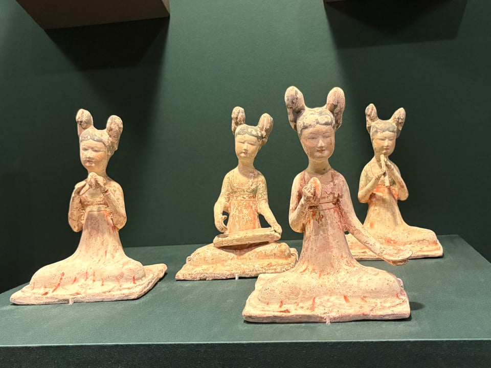 Four small statues of musicians taken at the Asian Art Museum in San Francisco