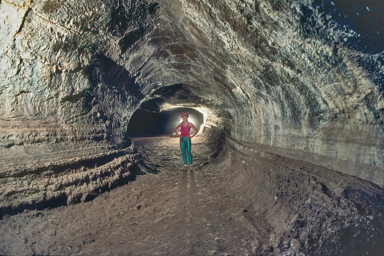 Valentine Cave, a lava tube in Lava Beds National Monument, California shows the classic tube shape; the grooves on the wall mark former flow levels. From Wikipedia.