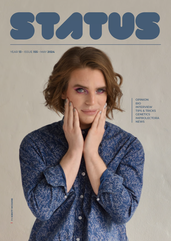 Cover of Status magazine with young white man wearing make-up and long brown hair