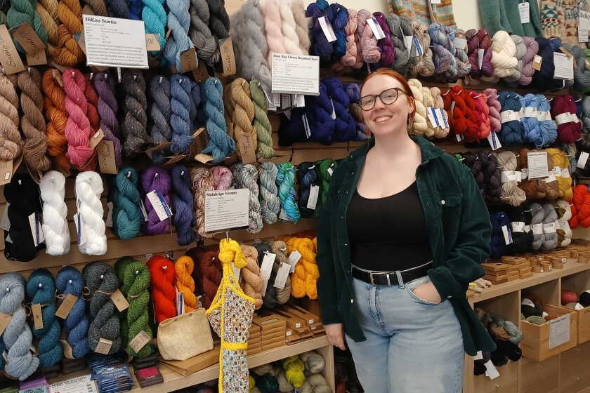 woman laughing alone with tariffs