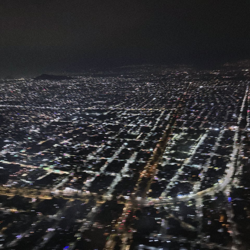 a blurry Mexico City seen from above on Christmas Eve