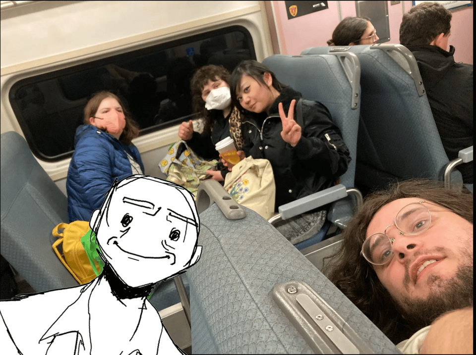 Group selfie photo of five Princeton Comic Maker members riding a train together. One of them is drawn in digitally.