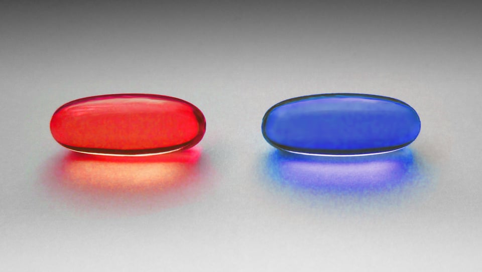 A picture of a red pill and a blue pill sitting on a surface