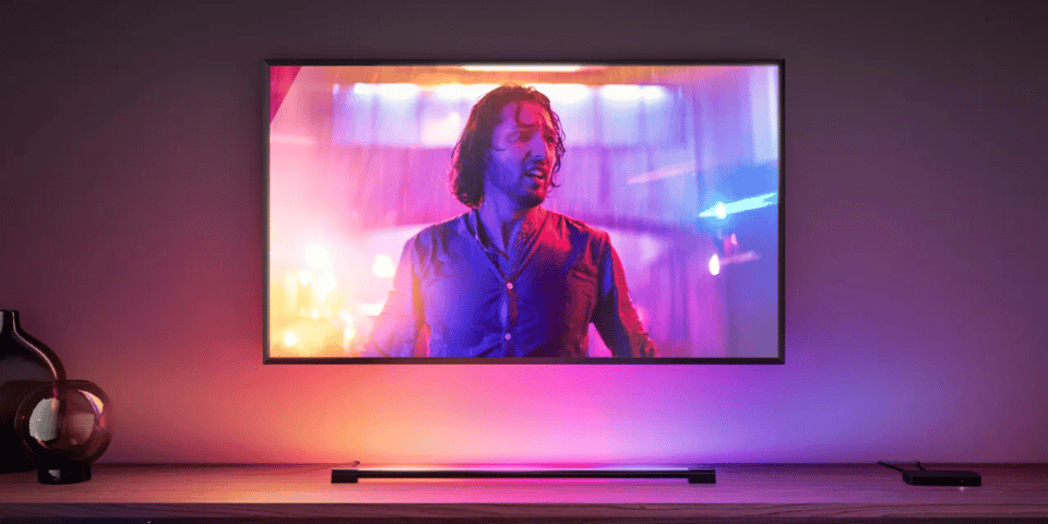 A TV with a multitude of lights surrounding it.