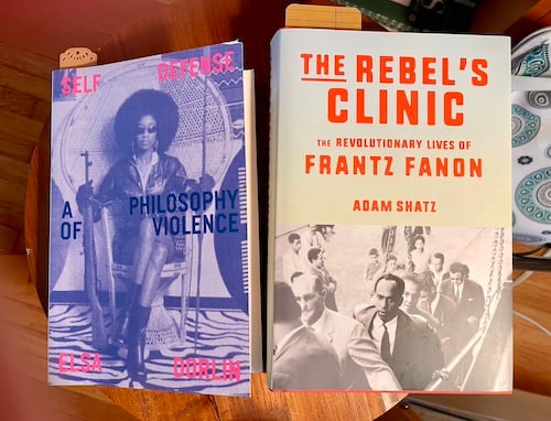 the covers of two books: Self Defense: A Philosophy of Violence by Elsa Dorlin and The Rebel's Clinic: The Revolutionary Lives of Frantz Fanon by Adam Schatz