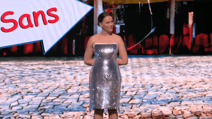 An animated gif of the inventor wearing the dress as it produces a wave-like pattern in response to her moving around