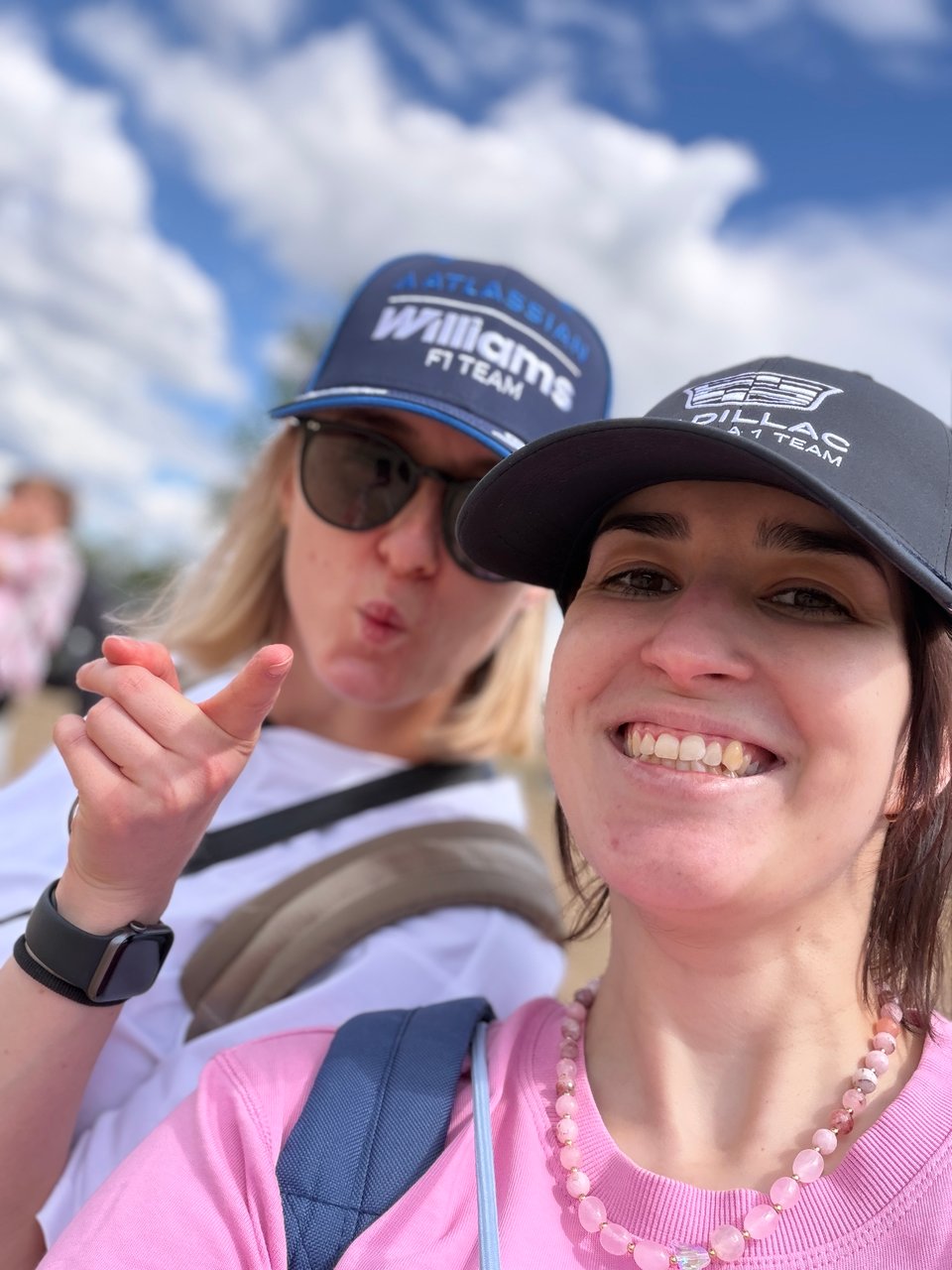 Two women takin a selfie wearing hats