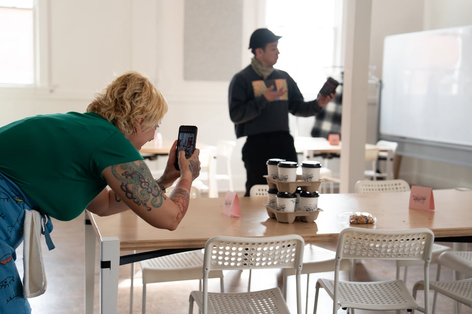 Beth taking a photo of coffee.