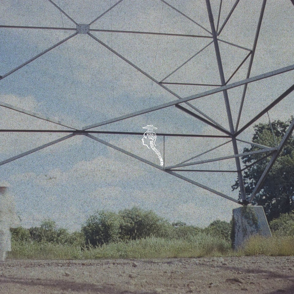 a tiny illustration of a person being abducted by aliens superimposed over the base of a stepdown tower