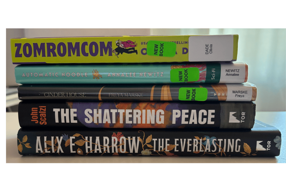 A stack of book, spines out. Books from the top down: Zomromcom, Automatic Noodle, Cinder House, The Shattering Peace, The Everlasting