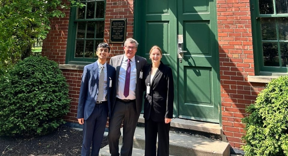 JMC students Asish Danappanavar (left) and Grace Fitzgerald (right) with Canadian Consul General Colin Bird.