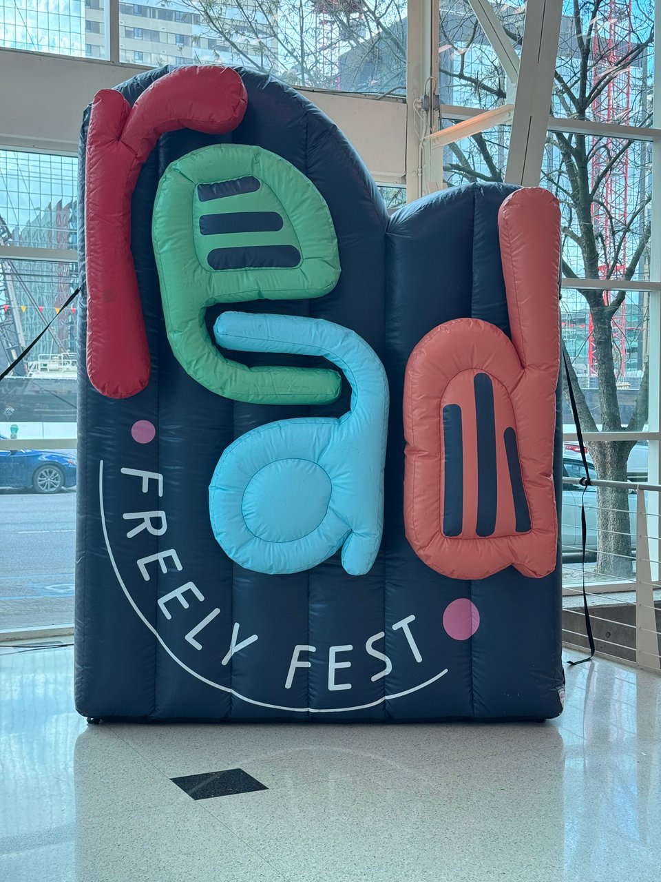 A large blow-up sign that reads Read Freely Fest in colorful letters on a dark blue background.