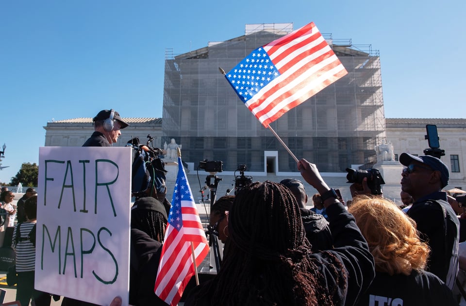 Voting rights activists gather outside the Supreme Court in Washington on Oct. 15, 2025, as the justices prepare to take up a major Republican-led challenge to the Voting Rights Act, the centerpiece legislation of the Civil Rights Movement. | Cliff Owen/AP