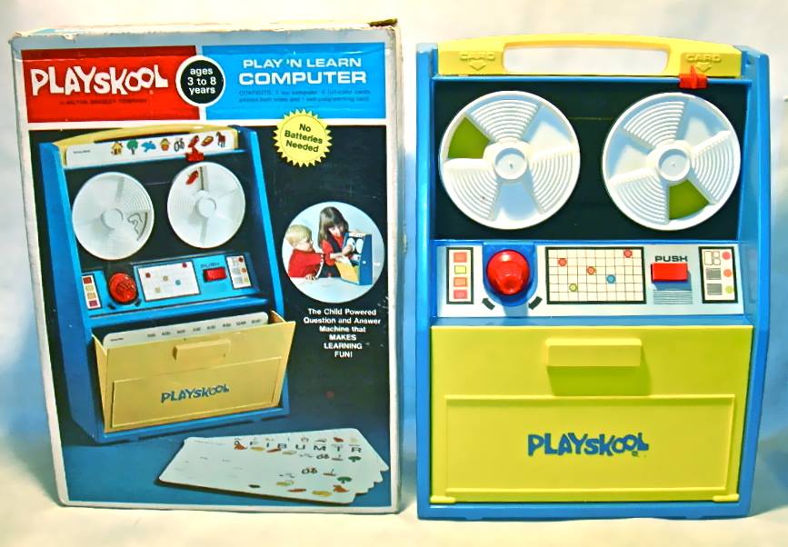 A playskool play n learn mainframe computer with a picture of a white blond boy and a slightly older white girl with brown hair playing with it. No batteries needed. ages 3 to 8