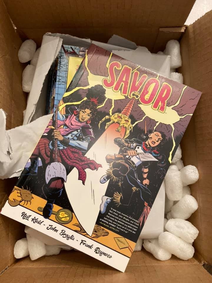 a box of books, freshly opened, copies of Savor by Kleid, Broglia and Reynoso