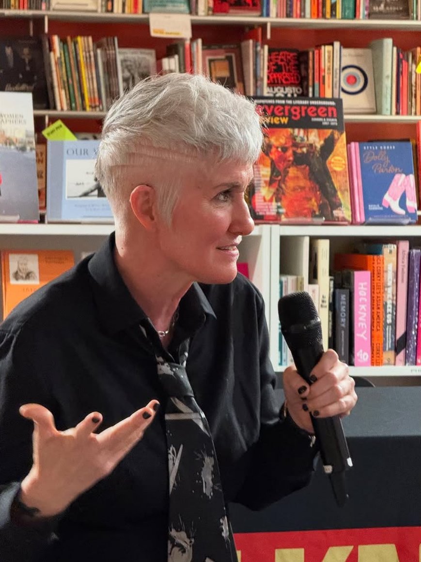 Me with a mic, talking smack in a bookstore