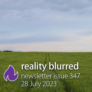 A field of grass with two tire tracks through it, disappearing at the horizon, and the words 'reality blurred newsletter issue 347, 28 July 2023'