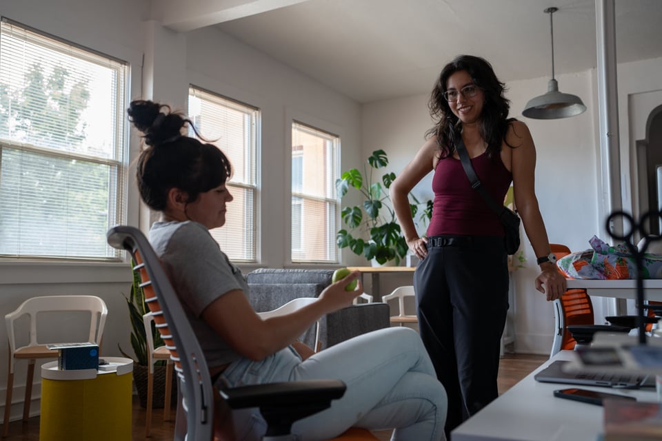 Lexi giving Livvy an apple.