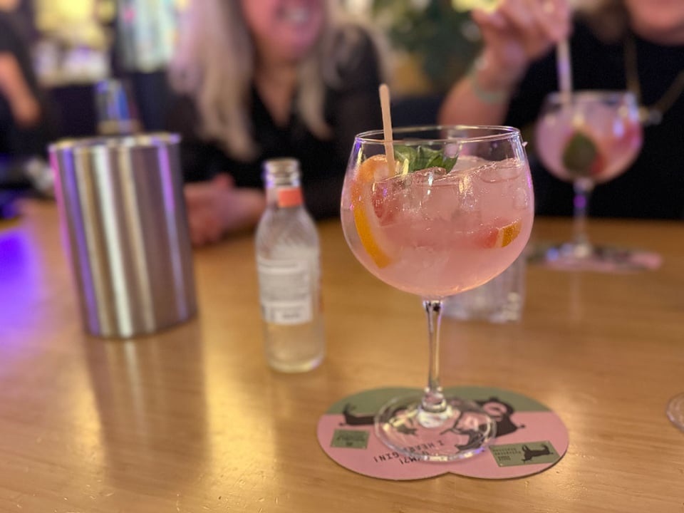 A pink grapefruit gin on a table.