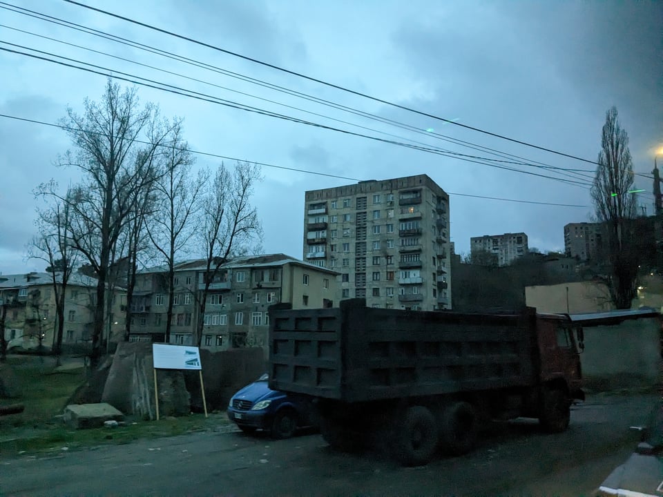 Chiatura, Georgia - there's a concrete, plattenbau block of flats in the background