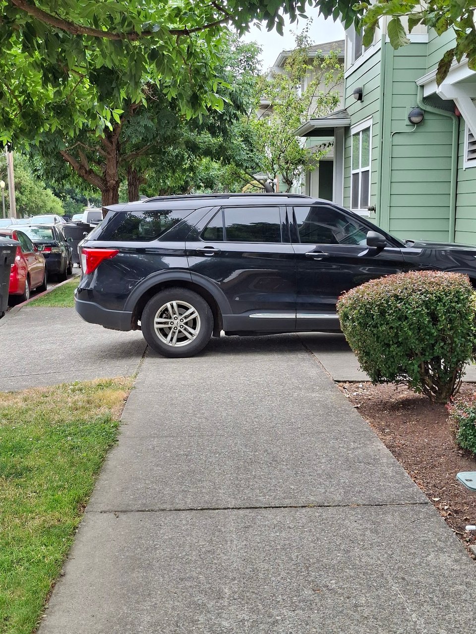 Large SUV blocking the sidewalk