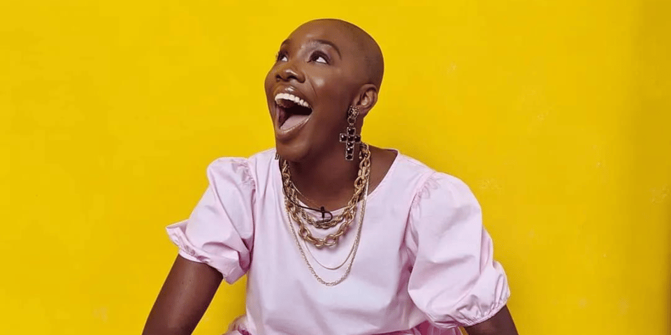 Yomi Adegoke in front of a yellow background.