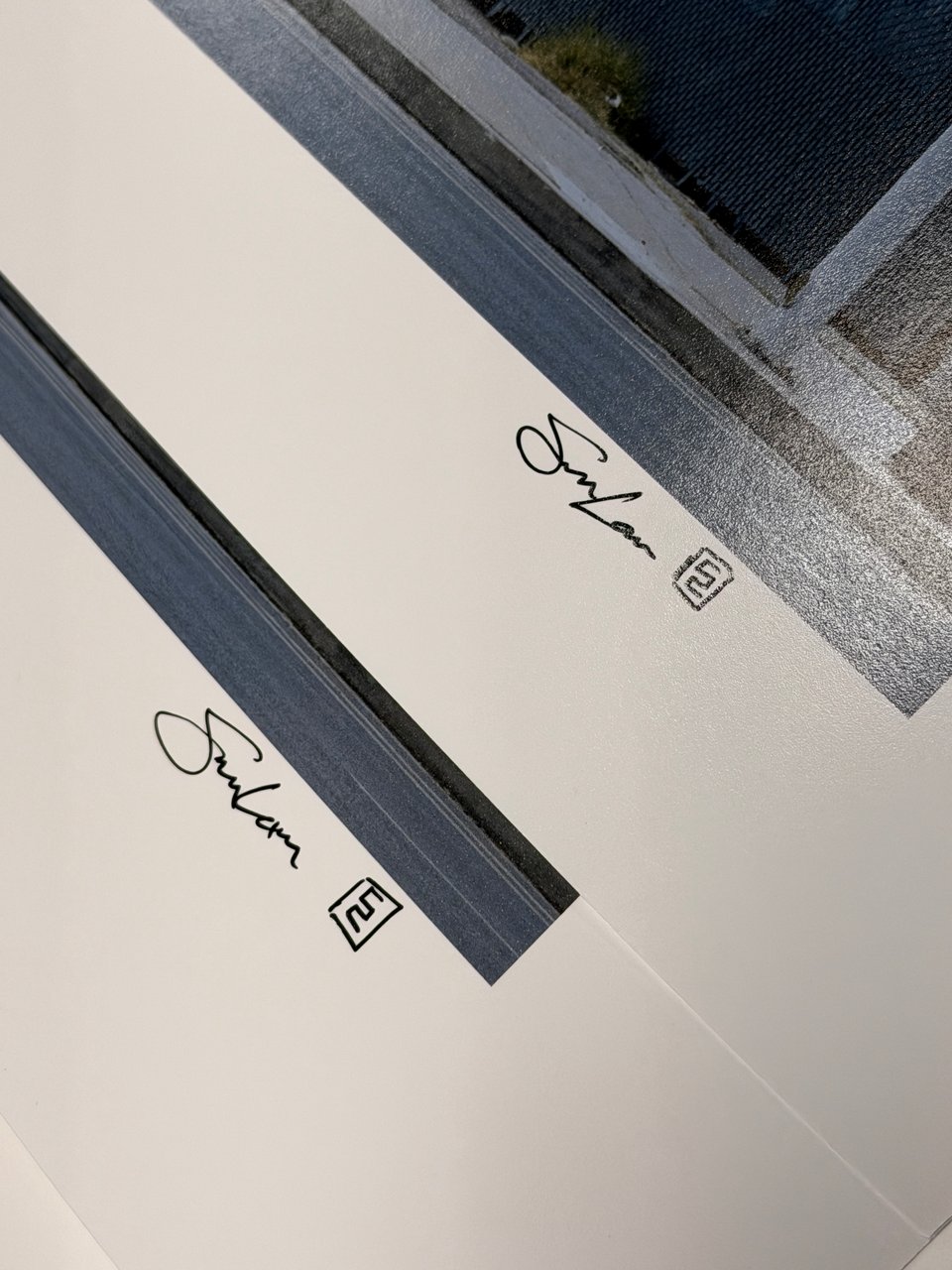 A close-up of my signatures on the two prints of my "One Stop Mini-Mart" artwork.