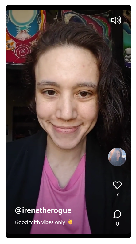 still from a different vid, i'm weird a pink shirt and smiling like the Grinch