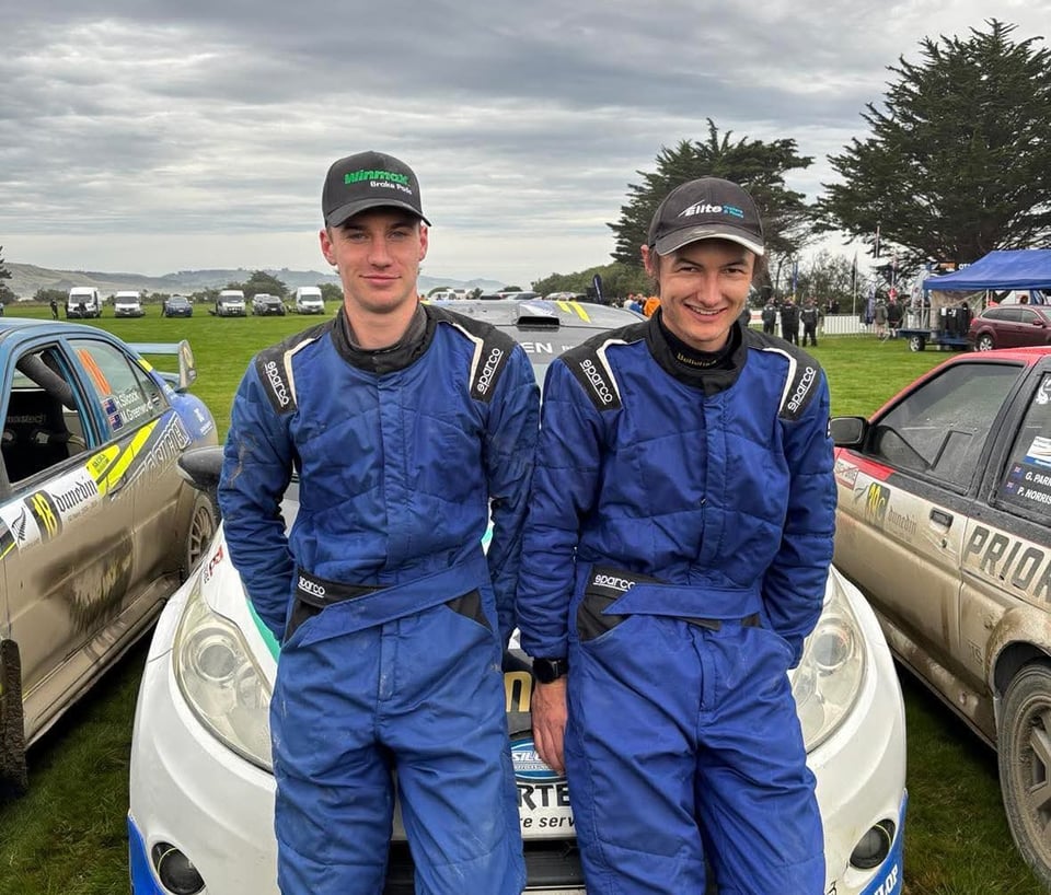 Josh Silcock and his co-driver in front of their Ford Fiesta rally car