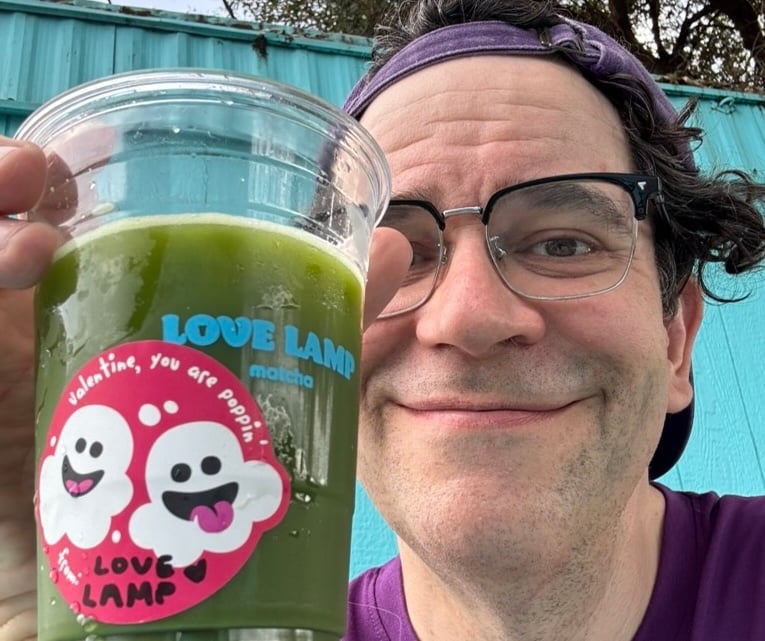 roy with a matcha drink from Love Lamp Matcha