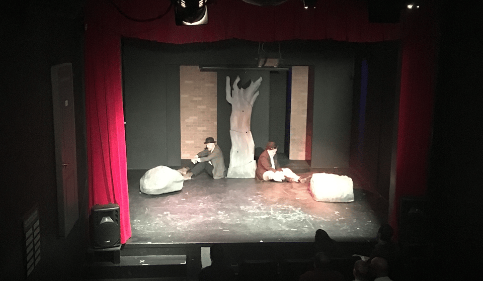 Pictured: 2 men sitting on a stage. Escape from Godot at the Hollywood Fringe Festival 5 years ago.