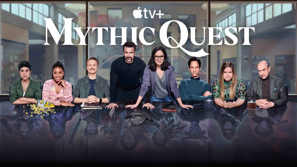 Mythic Quest press release with the actors along a table.