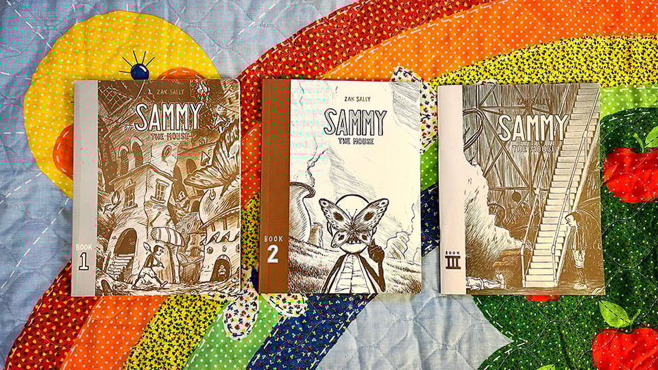 Sammy the Mouse volumes 1-3 on a rainbow blanket