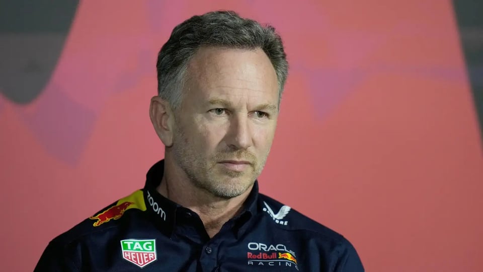 Christian Horner looking concerned, almost disappointed, in his team shirt in an interview somewhere.