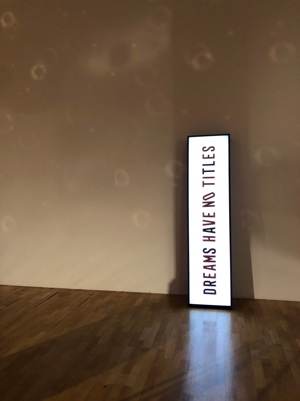 A sign saying: Dreams have no titles