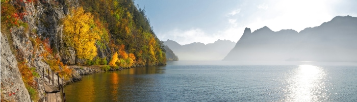 a lake with mountains in the background