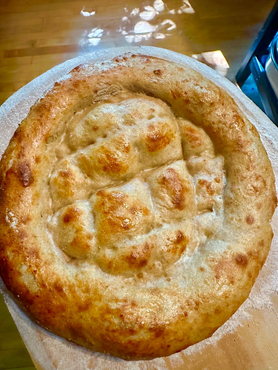 a photo of a golden brown matnakash, a fluffy Armenian flat bread