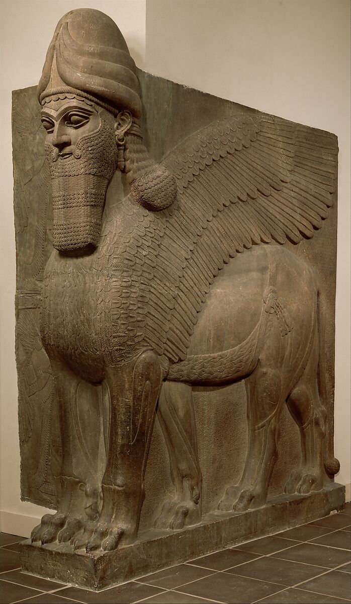 Assyrion lion statue carved in stone, 9th c. BCE.