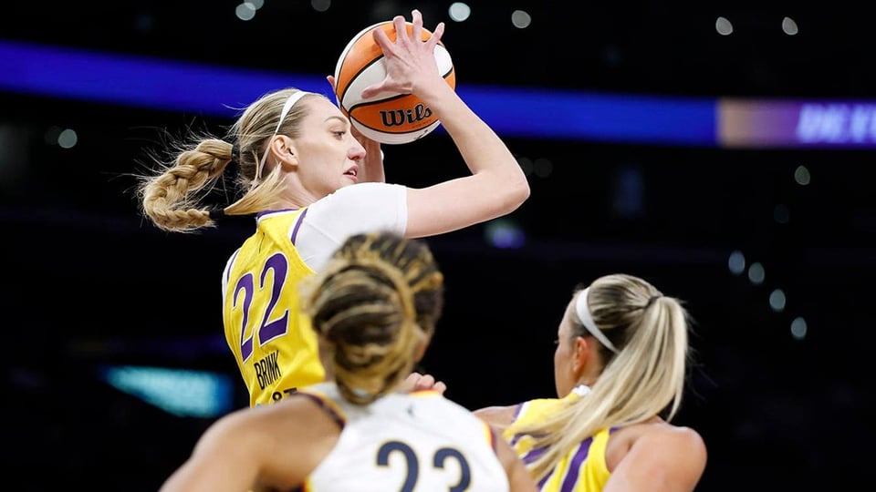 Cameron Brink of the Los Angeles Sparks controls a rebound over Aerial Powers and Julie Allemand during the Indiana Fever's 76-75 win at Crypto.com Arena in Los Angeles, Calif., on Aug. 29, 2025