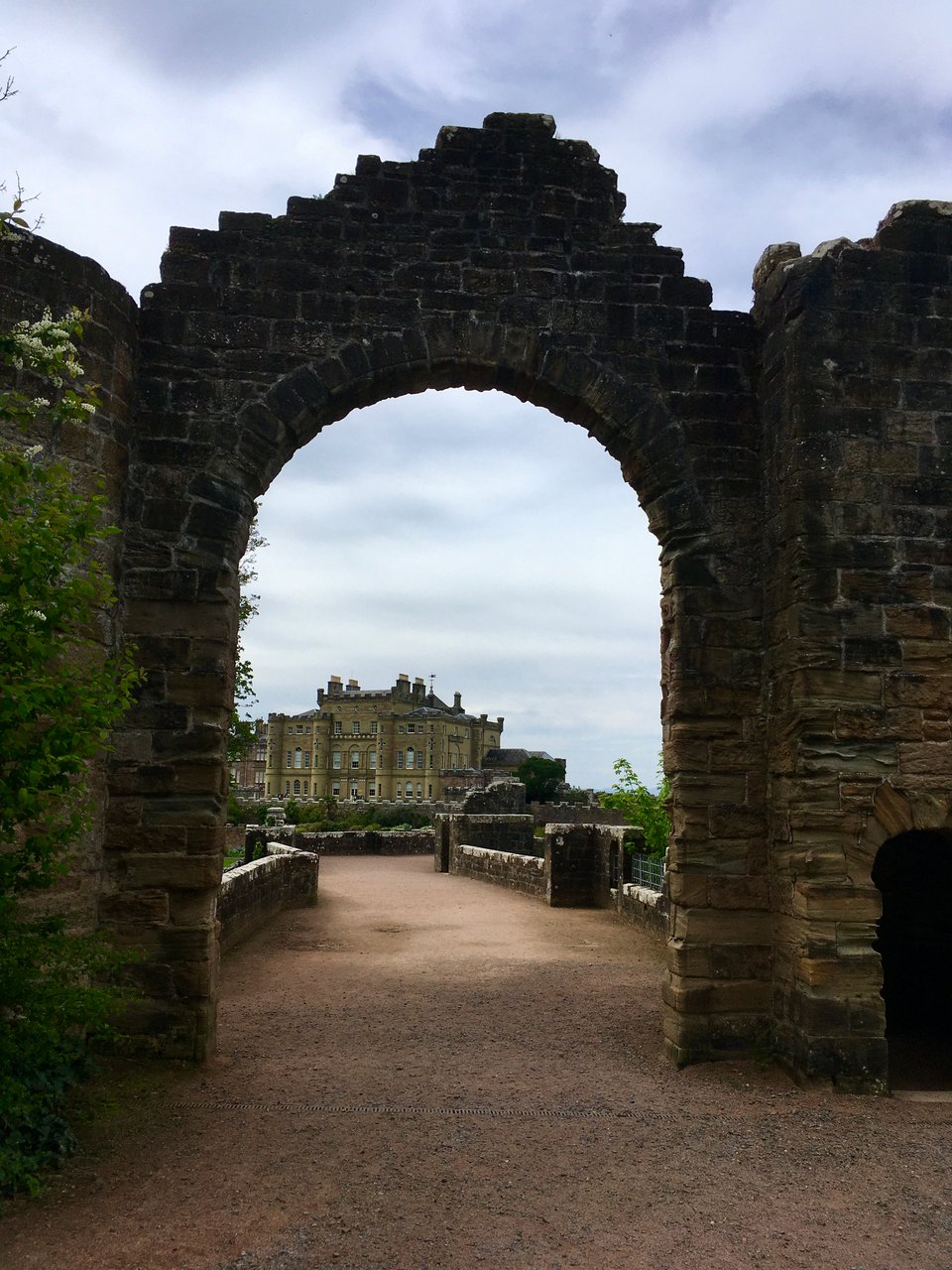 Culzean Castle in Scotland, viewed through a huge stone arch