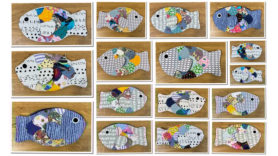 Pencil cases in the shape of fish sewn by children.