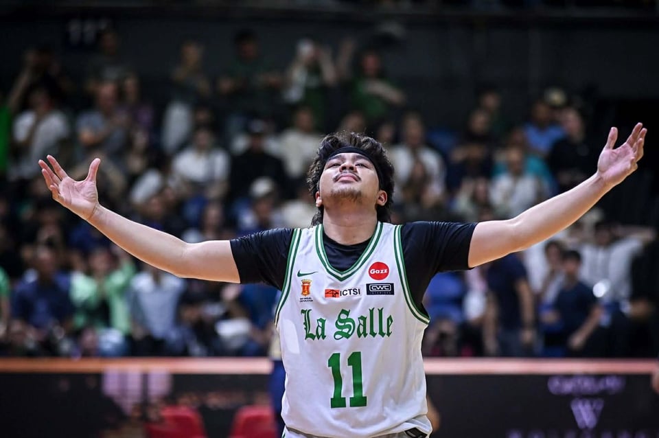 a filipino baller stretches out his arms to rile up the crowd, so much swag