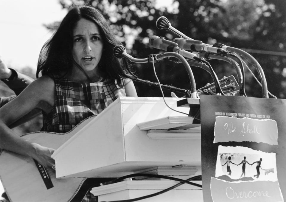 Joan Baez playing and singing at the March on Washington in 1963