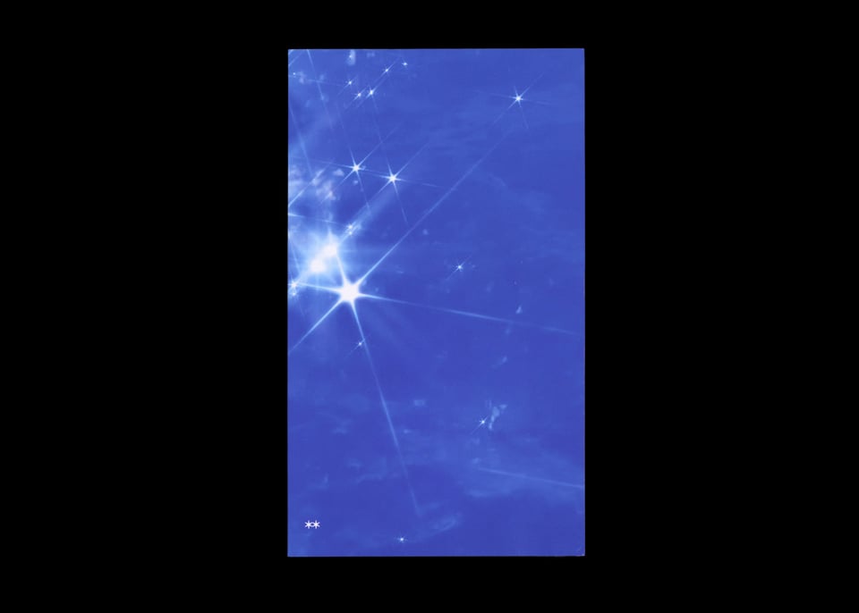 [A deep clue cover against a black background. The cover image is a still of cloudy, computer-generated water shimmering with sun sparkles.]