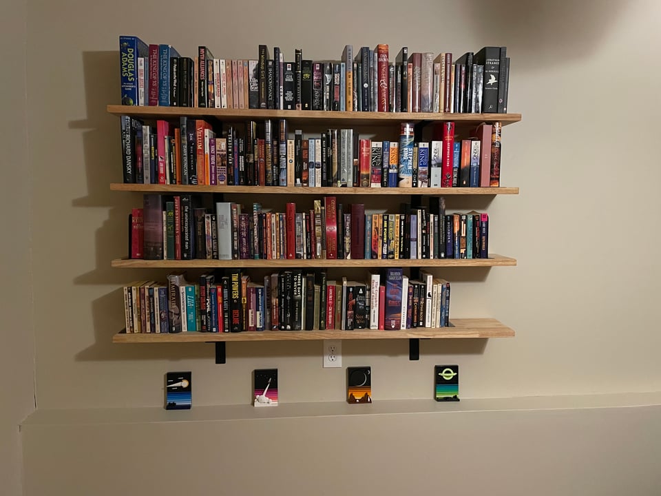 Floating shelves filled with books.